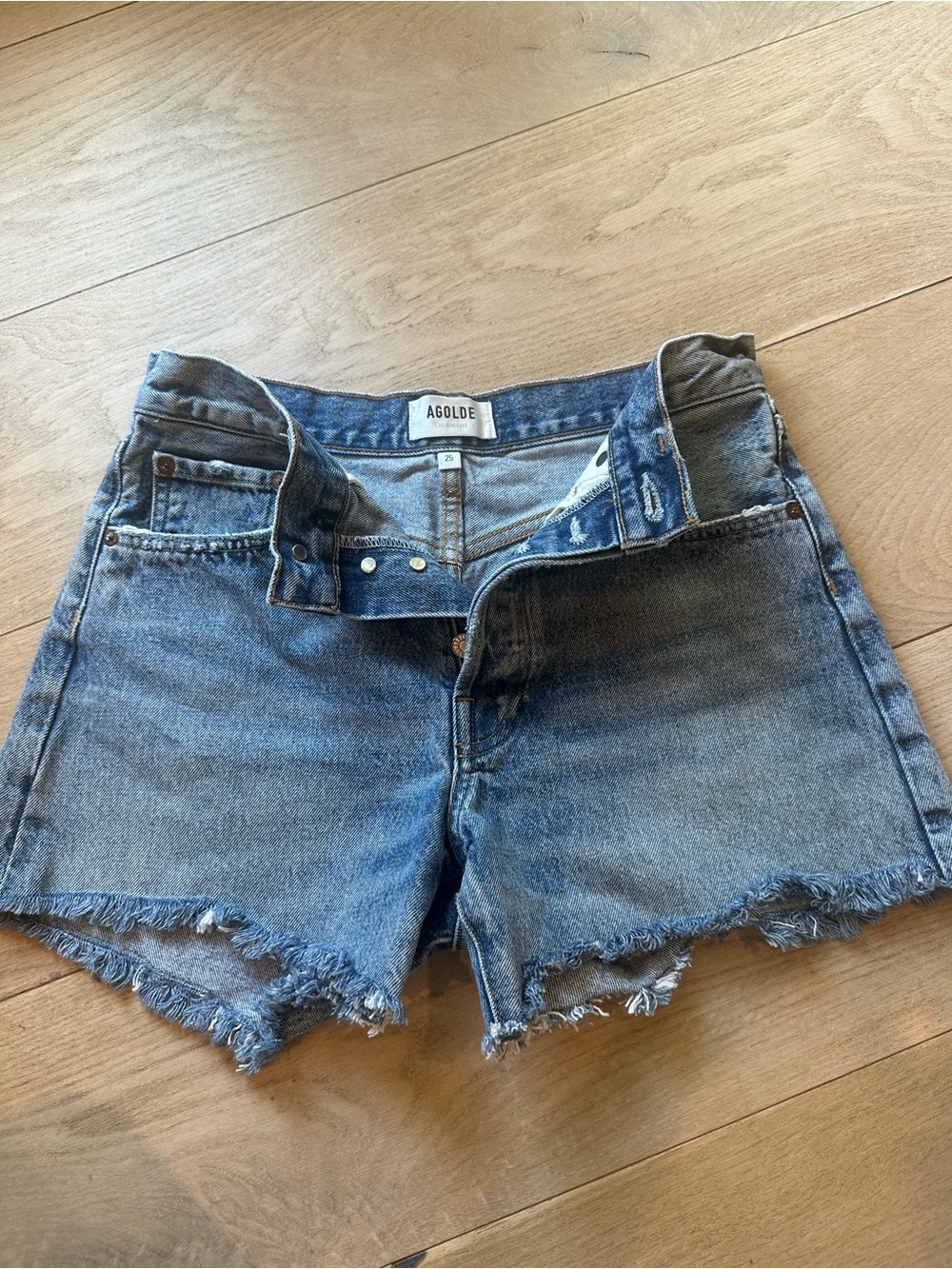 Agolde Light Blue Frayed Denim Cutoff Shorts